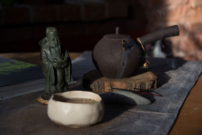 Close-up of sculptures on table at home