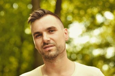 Portrait of young man against blurred background