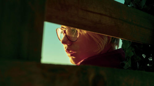 Close-up portrait of woman wearing sunglasses