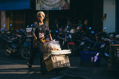 Full length portrait of woman sitting in bus