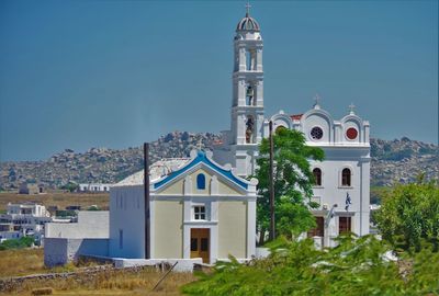 View of buildings against blue sky