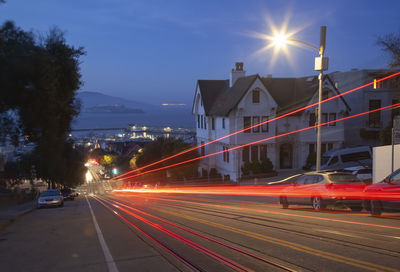 High angle view of light trails on road at night