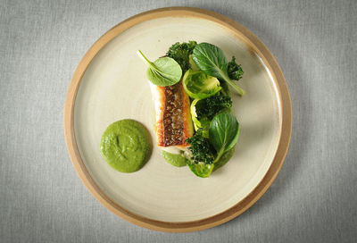 High angle view of fish salad in plate on table