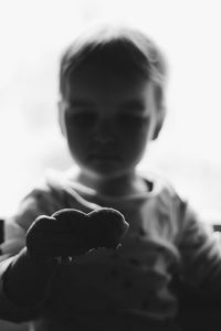Close-up of boy holding leaf