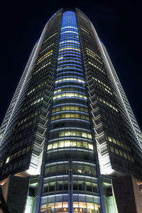 Low angle view of skyscraper at night