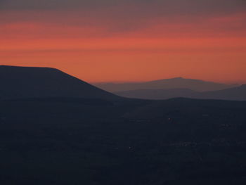 Scenic view of mountains at sunset