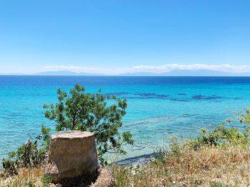 Scenic view of sea against blue sky