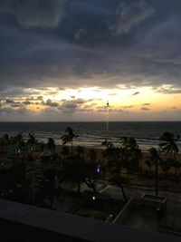 View of swimming pool at beach during sunset