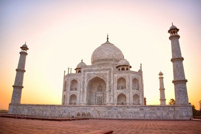 View of historic building against sky at sunset