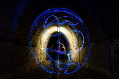 Light painting against blue sky at night