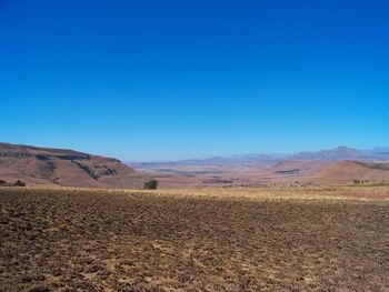 Scenic view of landscape against clear blue sky