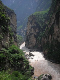 Scenic view of waterfall amidst rocks