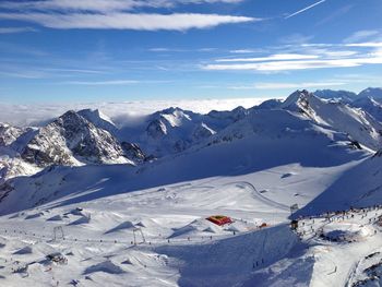 Scenic view of snowcapped mountains against sky