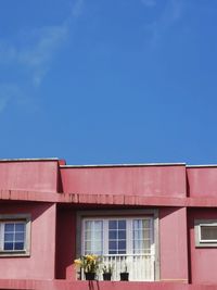 Low angle view of building against blue sky