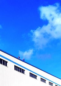 Low angle view of building against blue sky