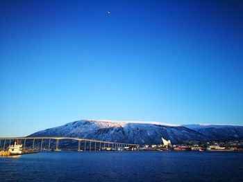 Scenic view of mountains against clear blue sky