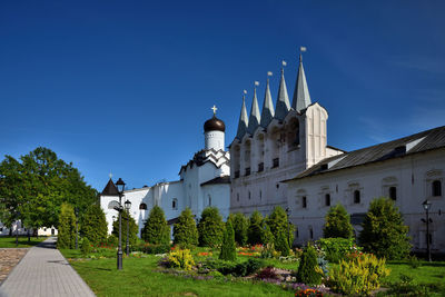 View of buildings against blue sky