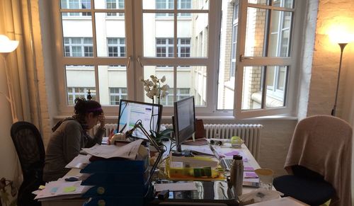 Stressed businesswoman sitting at desk in office