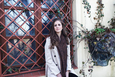 Beautiful girl in a beige coat on the street