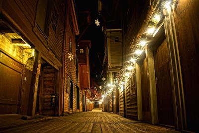 Illuminated walkway at night