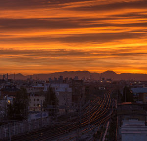 High angle view of buildings against sky during sunset