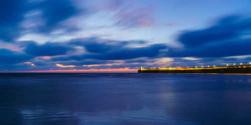 Scenic view of sea against sky at sunset