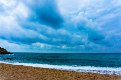 Scenic view of beach against sky