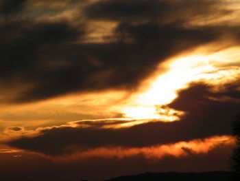 Low angle view of dramatic sky during sunset
