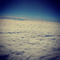 Scenic view of landscape against blue sky