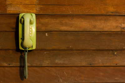 Telephone on wooden table