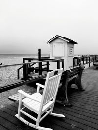 Built structure on pier at beach against clear sky