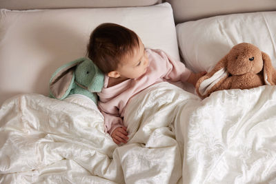 Young woman sleeping on bed at home