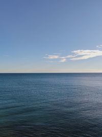 Scenic view of sea against blue sky