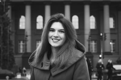 Close up attractive smiling woman on street monochrome portrait picture