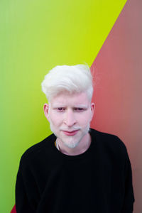 Portrait of an albino man looking in the camera