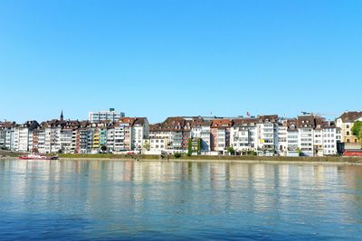 View of cityscape against clear blue sky