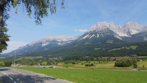 Scenic view of landscape and mountains against sky