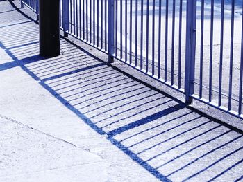 Shadow of railing on street