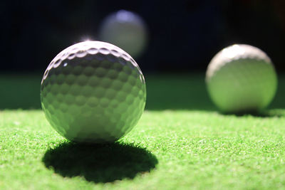 Close-up of golf ball on grass