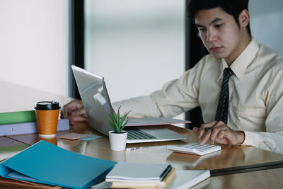 Portrait of businessman working at office