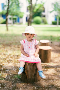 Full length portrait of girl wearing hat