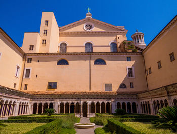 Facade of historic building against clear blue sky