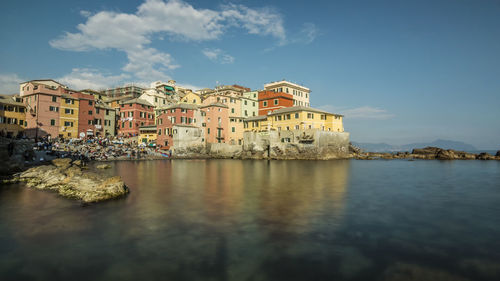 Typical fishing village with colored houses and crowded beach in the city of genoa