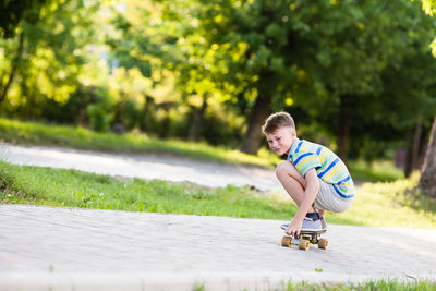 Full length of boy riding skateboarding on skateboard