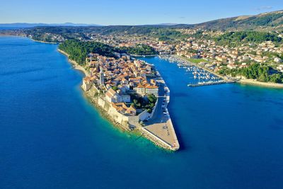 High angle view of bay against clear blue sky