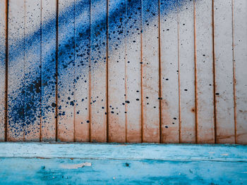 Full frame shot of weathered wall with graffiti