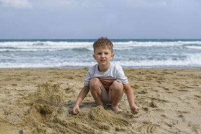 Portrait of happy boy on beach