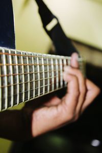 Cropped image of guitar playing guitar