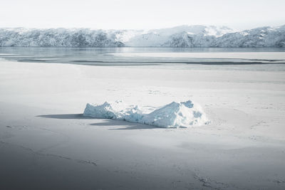 High angle view of iceberg in frozen sea