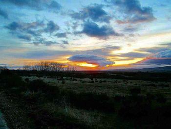 Scenic view of landscape at sunset